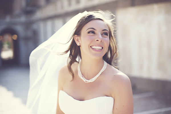 happy bride walkng in urban location - wedding photo by top Rome based destination wedding photographer Rochelle Cheever, Rome Weddings Photography